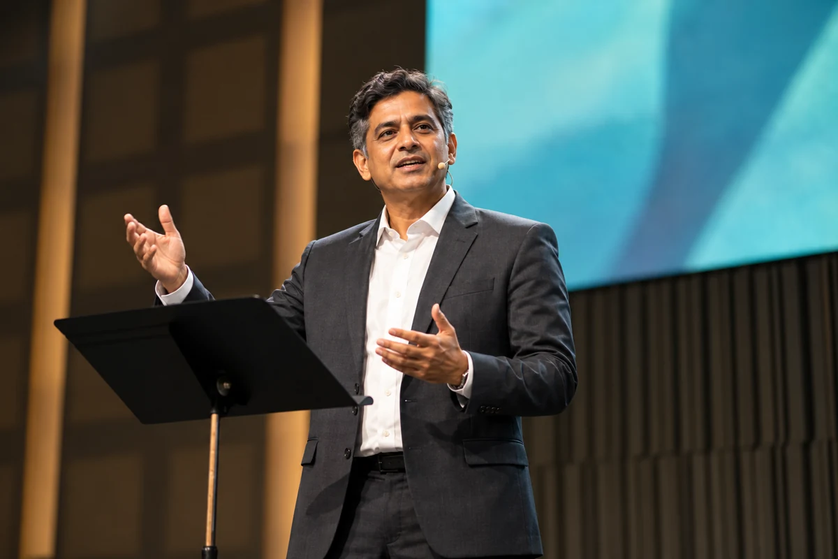 Indian business executive speaking at an industry event